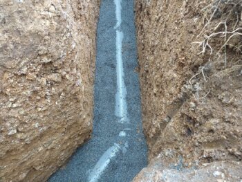 Enrobage du tube d'évacuation du réseau pluvial à Lagrave