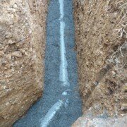 Enrobage du tube d'évacuation du réseau pluvial à Lagrave